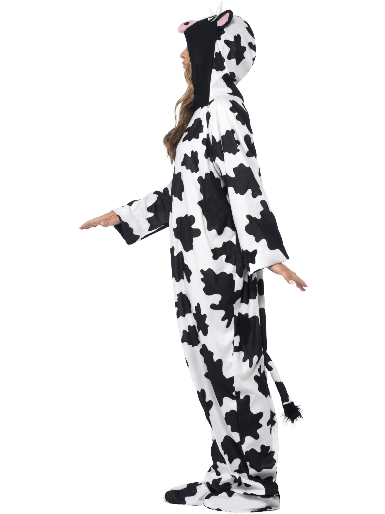 Mono de vaca blanco y negro con capucha, perfil lateral con brazos extendidos