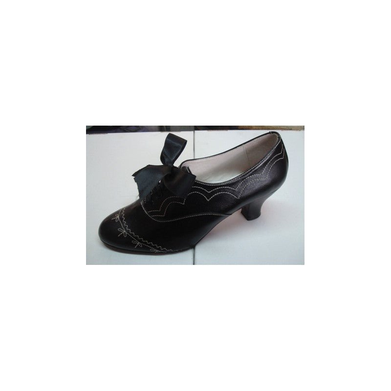 Zapato de piel negro con pespuntes y lazo, tacón bajo